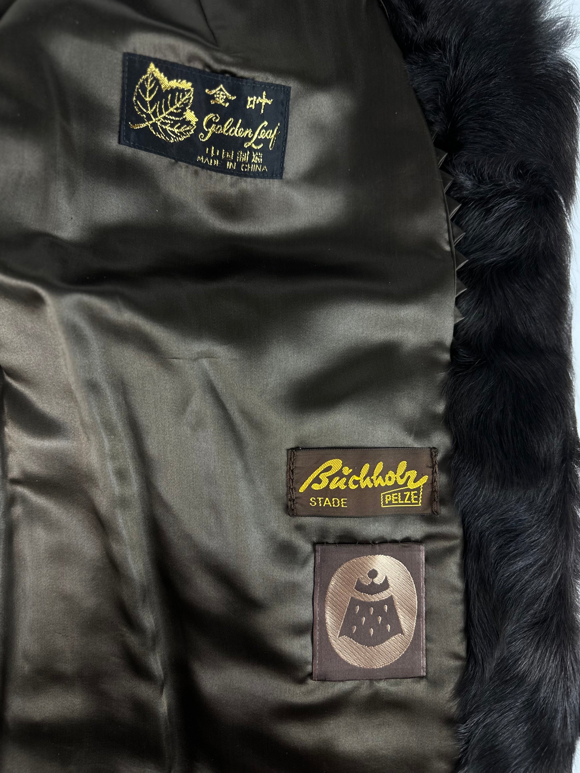Tag inside brown vintage goat fur coat