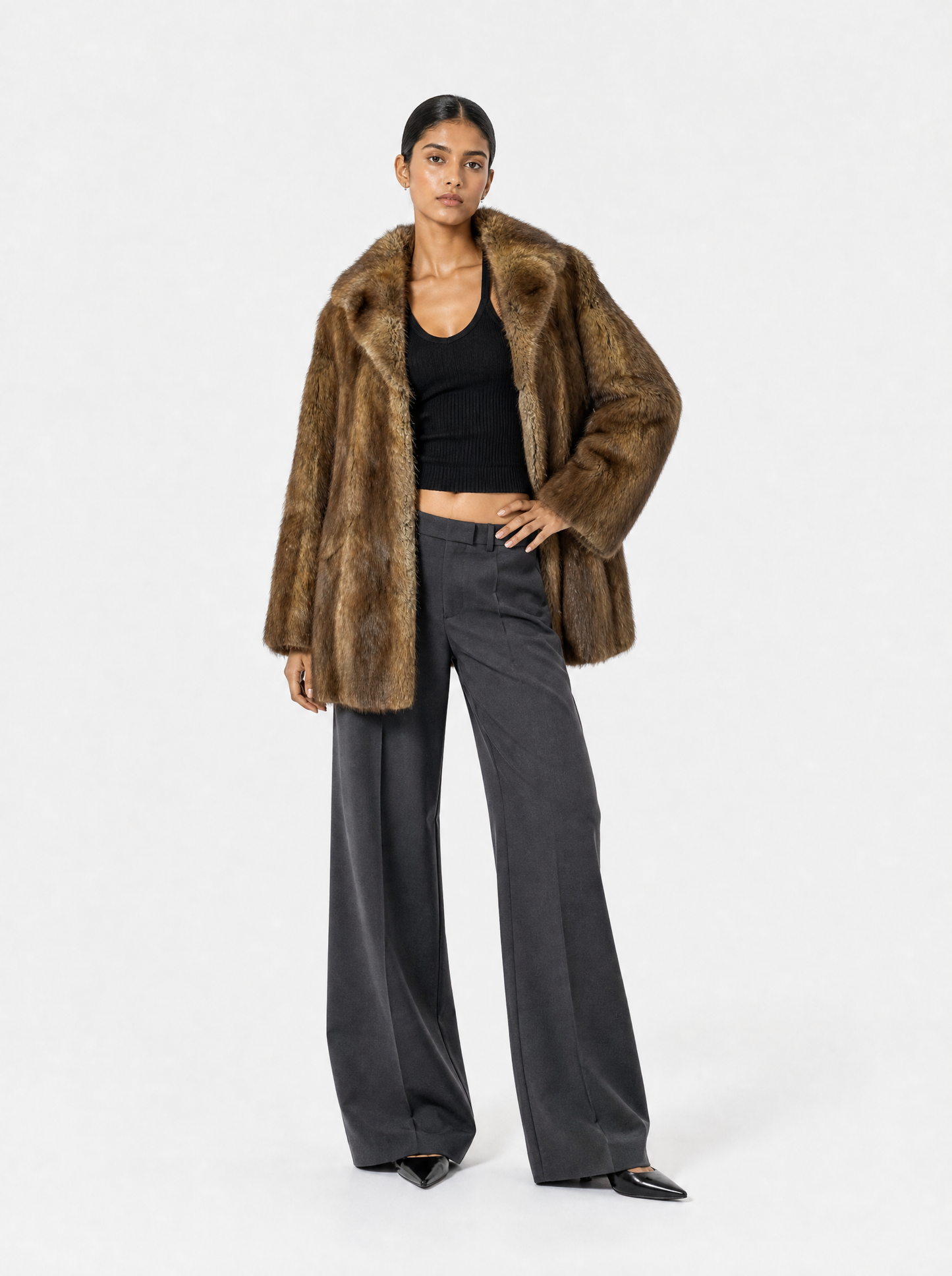 Brown vintage muskrat fur coat worn by a model