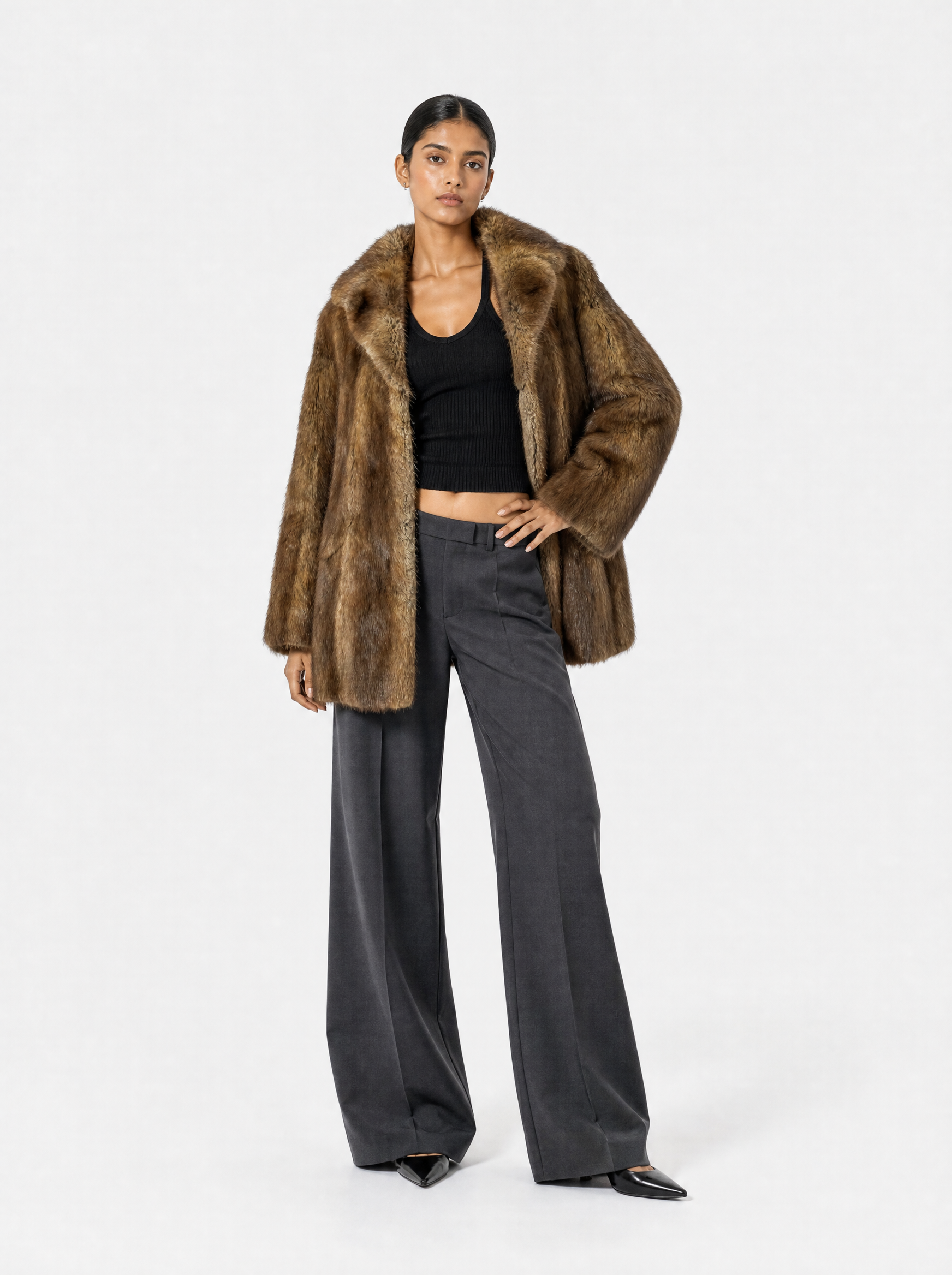 Brown vintage muskrat fur coat worn by a model