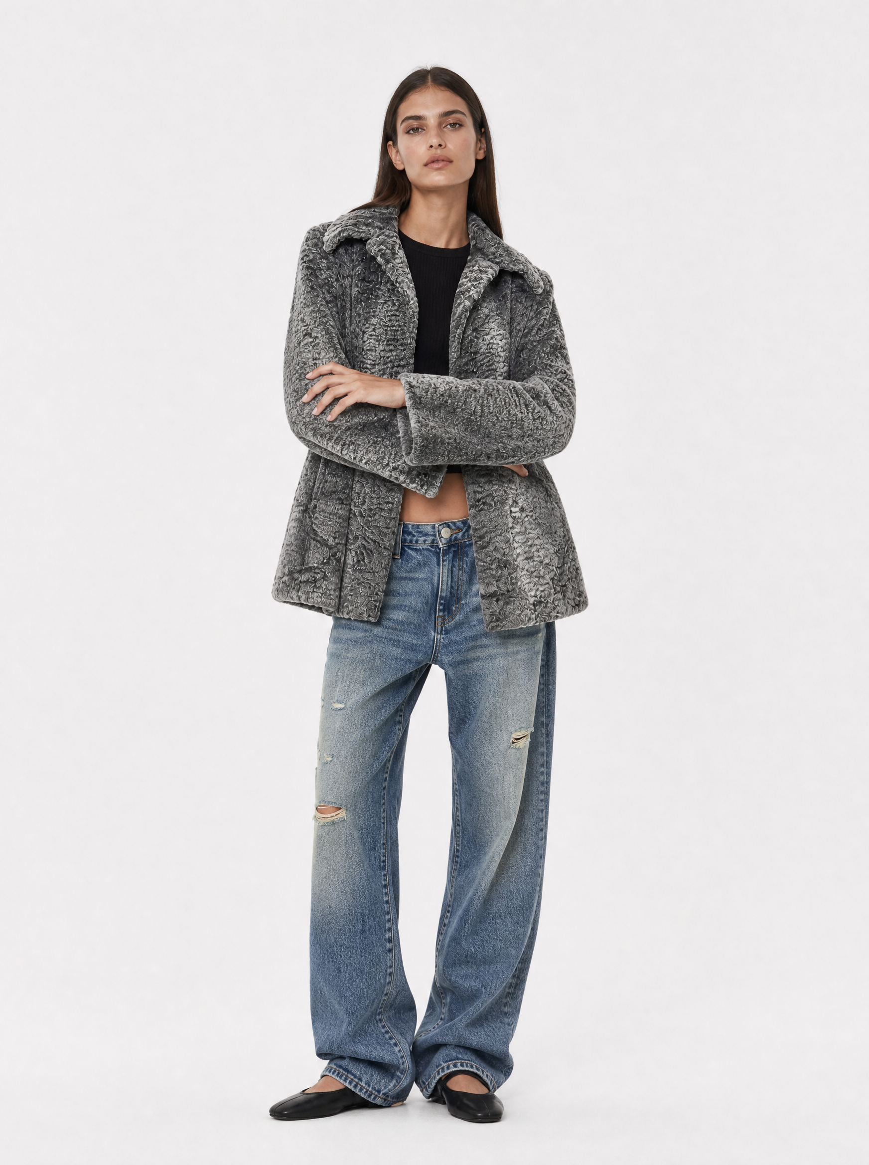 Grey vintage Persian lamb fur coat worn by a model