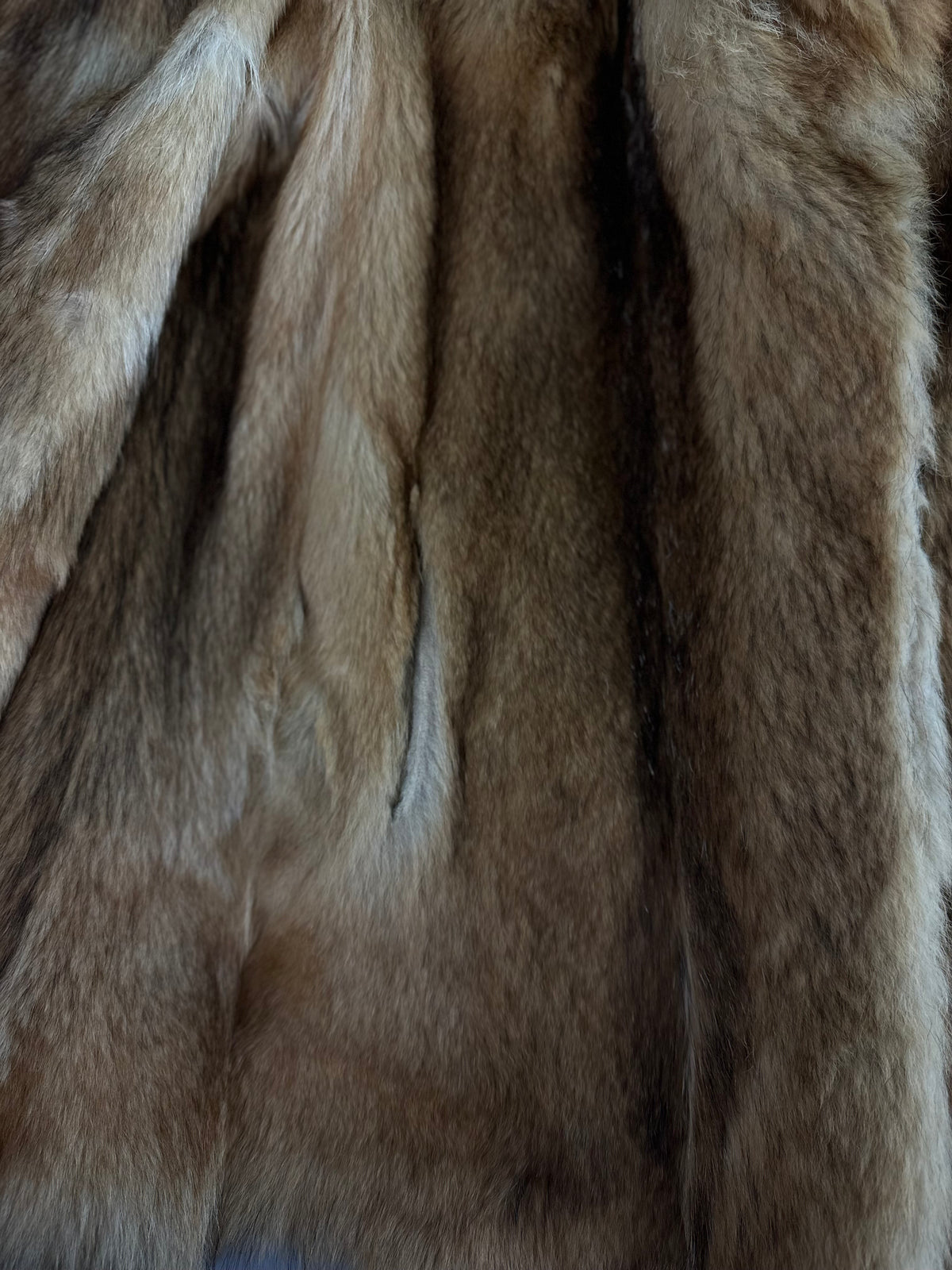 Close-up of orange vintage fox fur coat