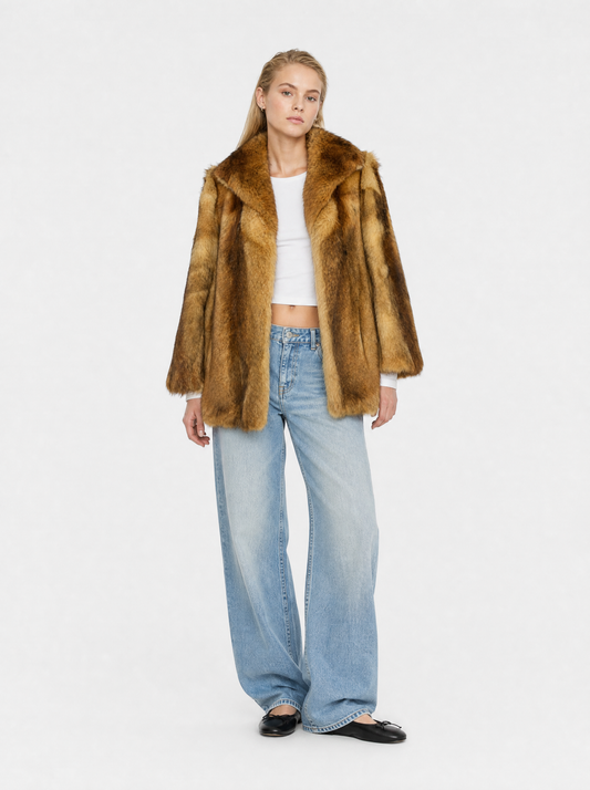 Orange vintage fox fur coat worn by a model