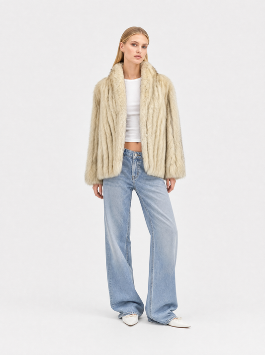 White vintage fox fur coat worn by a model